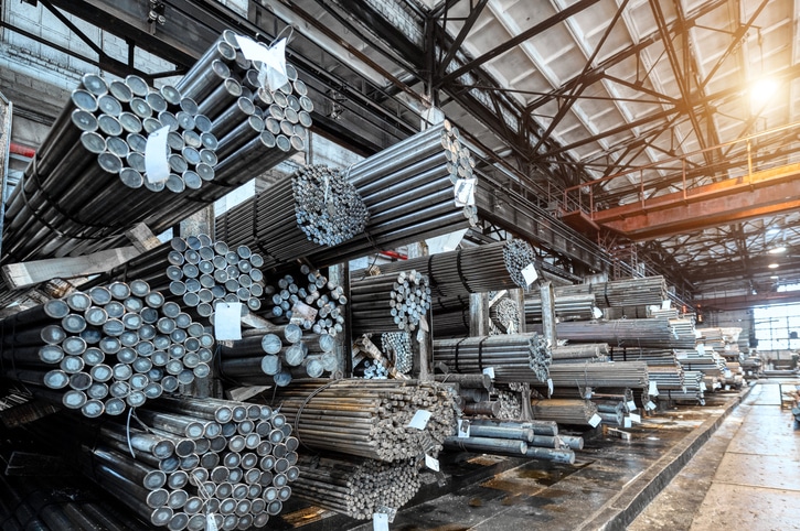 Rolled metal warehouse. Many packs of metal bars on the shelves like used to make abrasion anchors