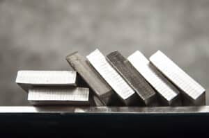 Pieces of stainless steel on shelf. Refractory anchors - High temperature alloys - refractory anchor materials. Refractory Anchors Inc. (RAI-1)